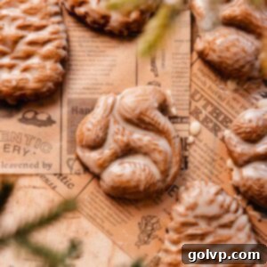 squirrel shaped and glazed gingerbread cookie on parchment paper