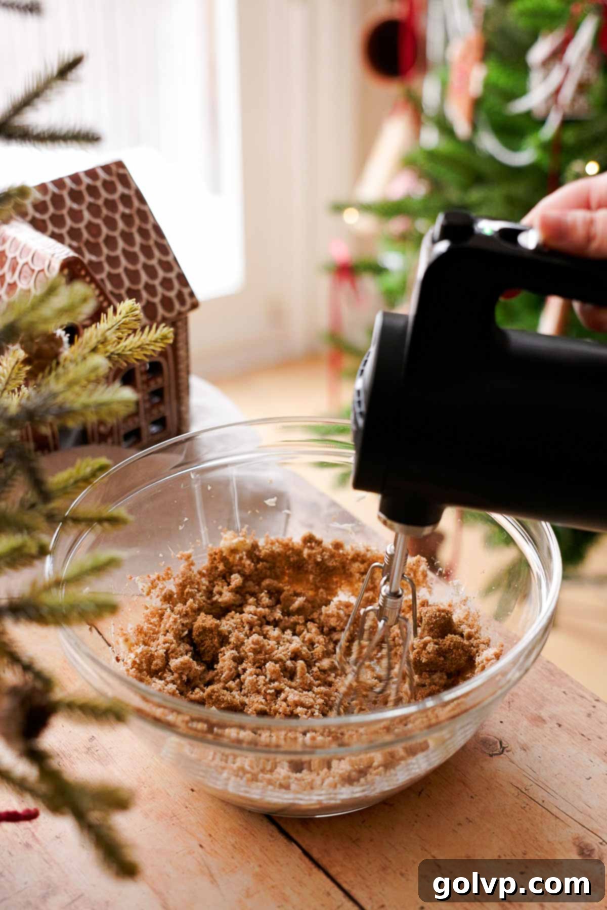 beating sugar and butter with an electric mixer for gingerbread cookies