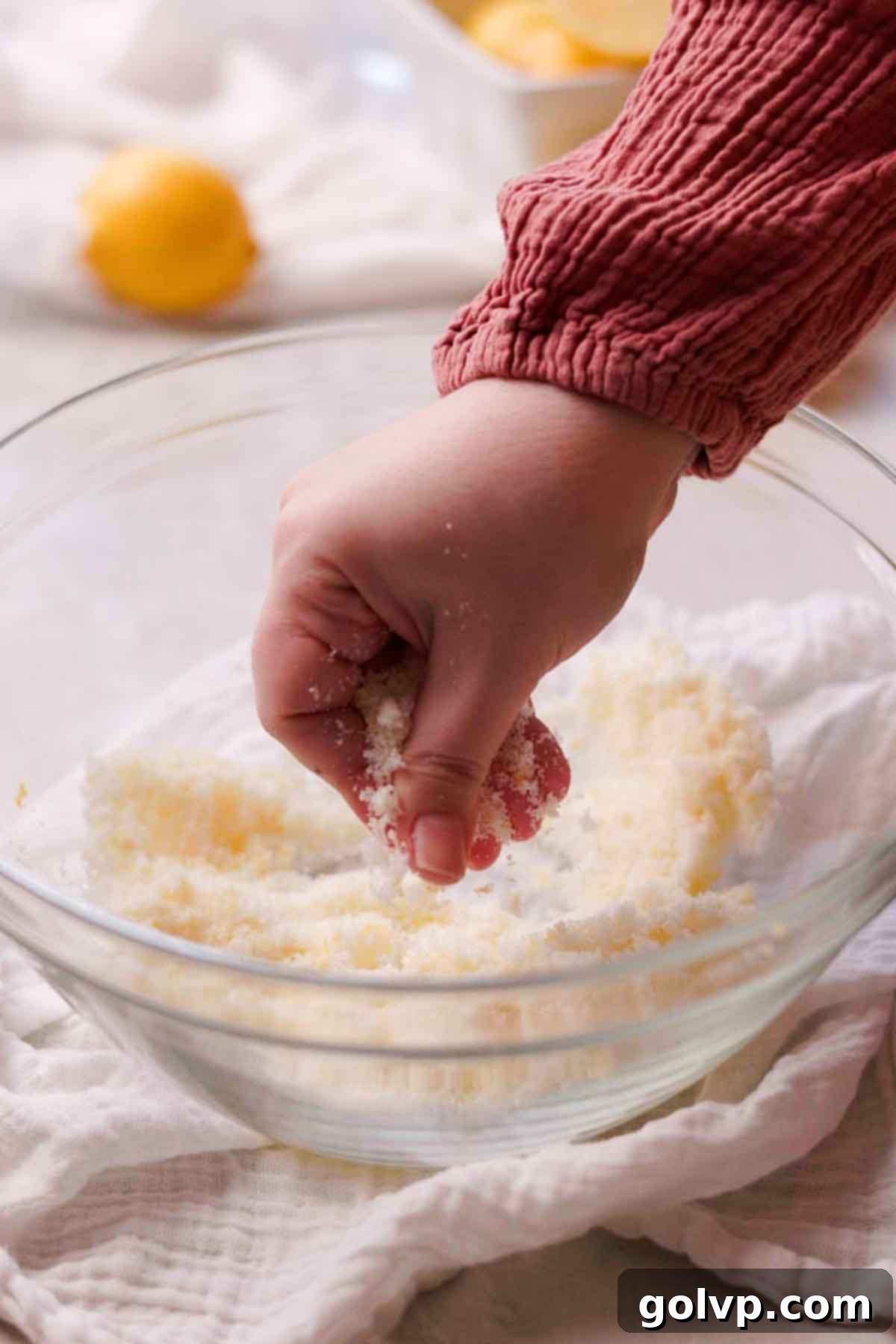 Sunshine Lemon Cheesecakes 7 rubbing sugar and lemon zest together with fingers