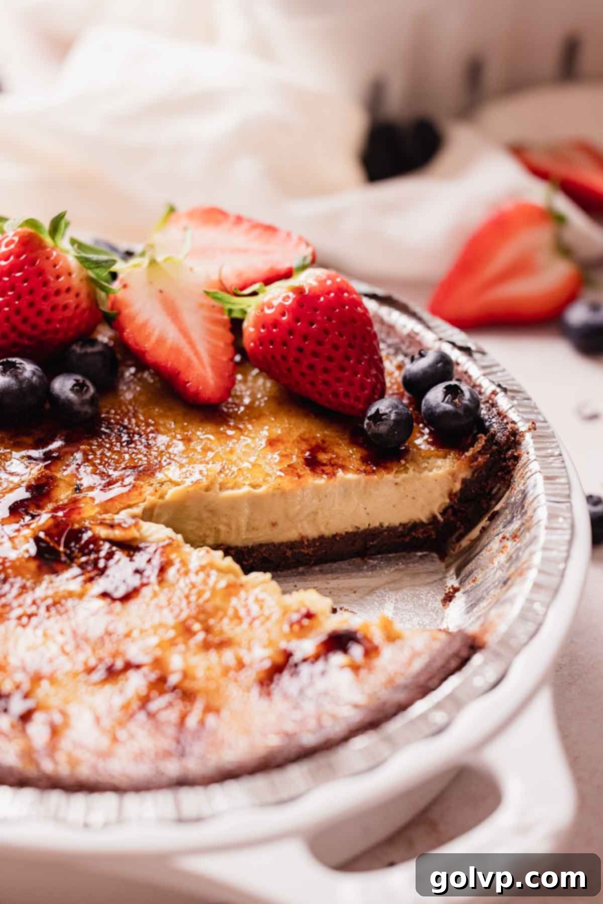 earl grey creme brulee pie, sliced with berries