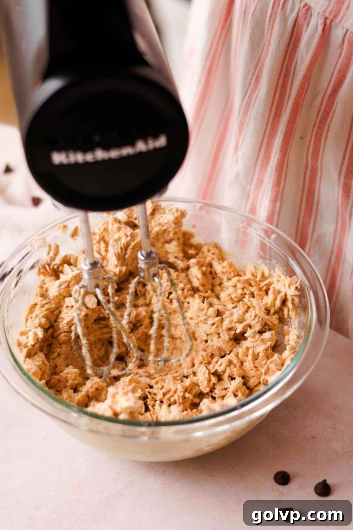 beating oatmeal cookie dough with added oats