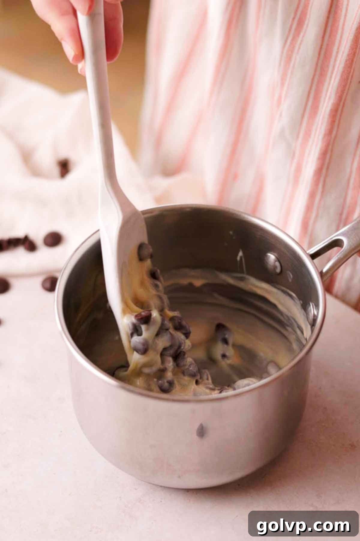 stirring chocolate fudge ingredients together in saucepan