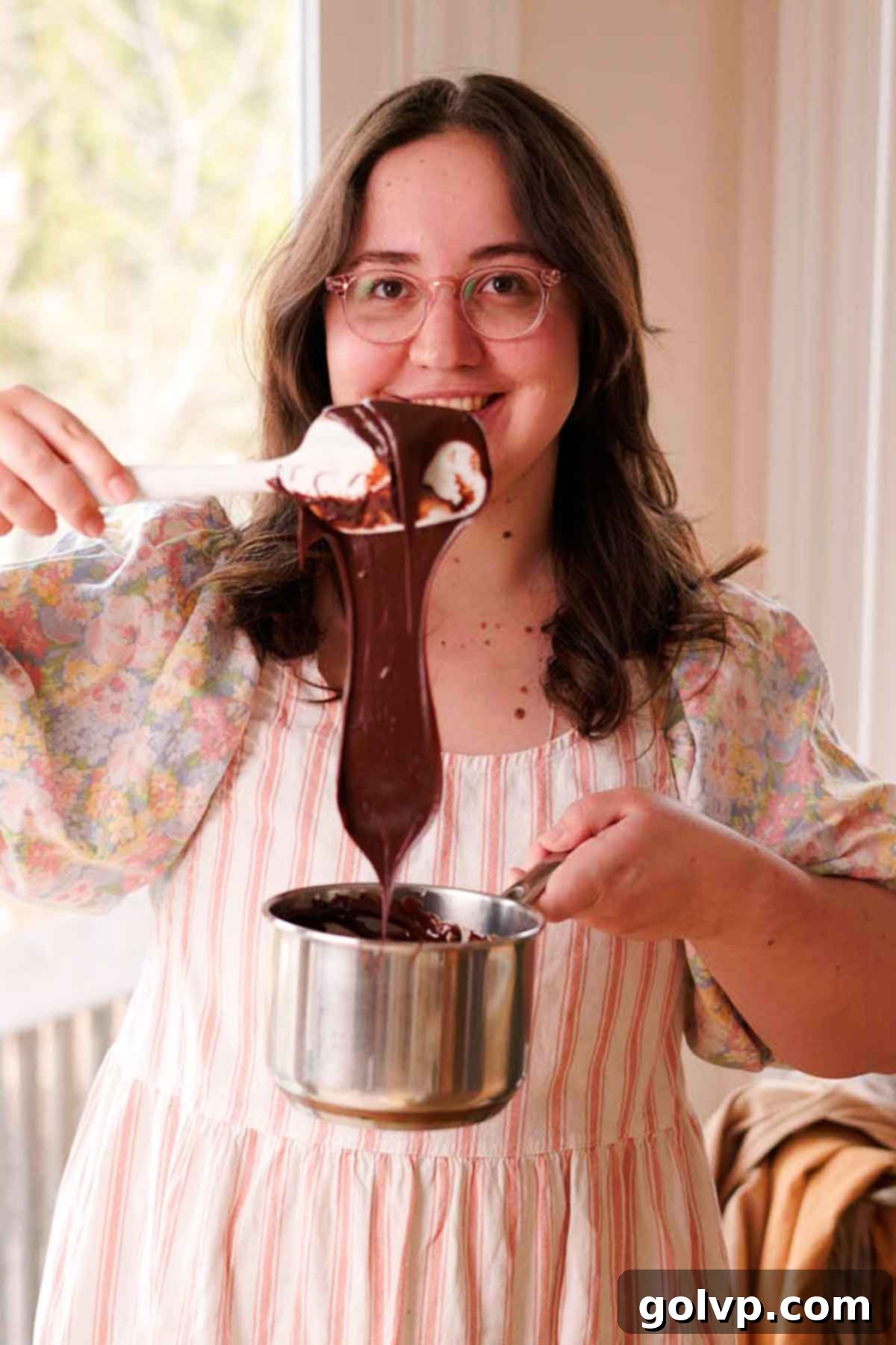 melted down creamy fudge texture falling off a spatula