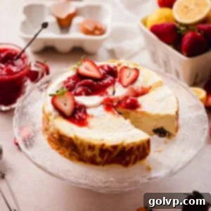 cottage cheese cheesecake with strawberries and sour cream on cake stand