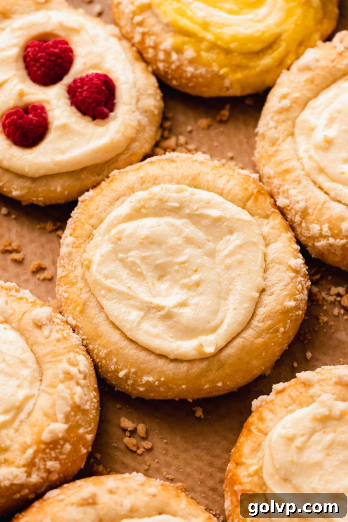 vatrushka with cottage cheese on parchment paper