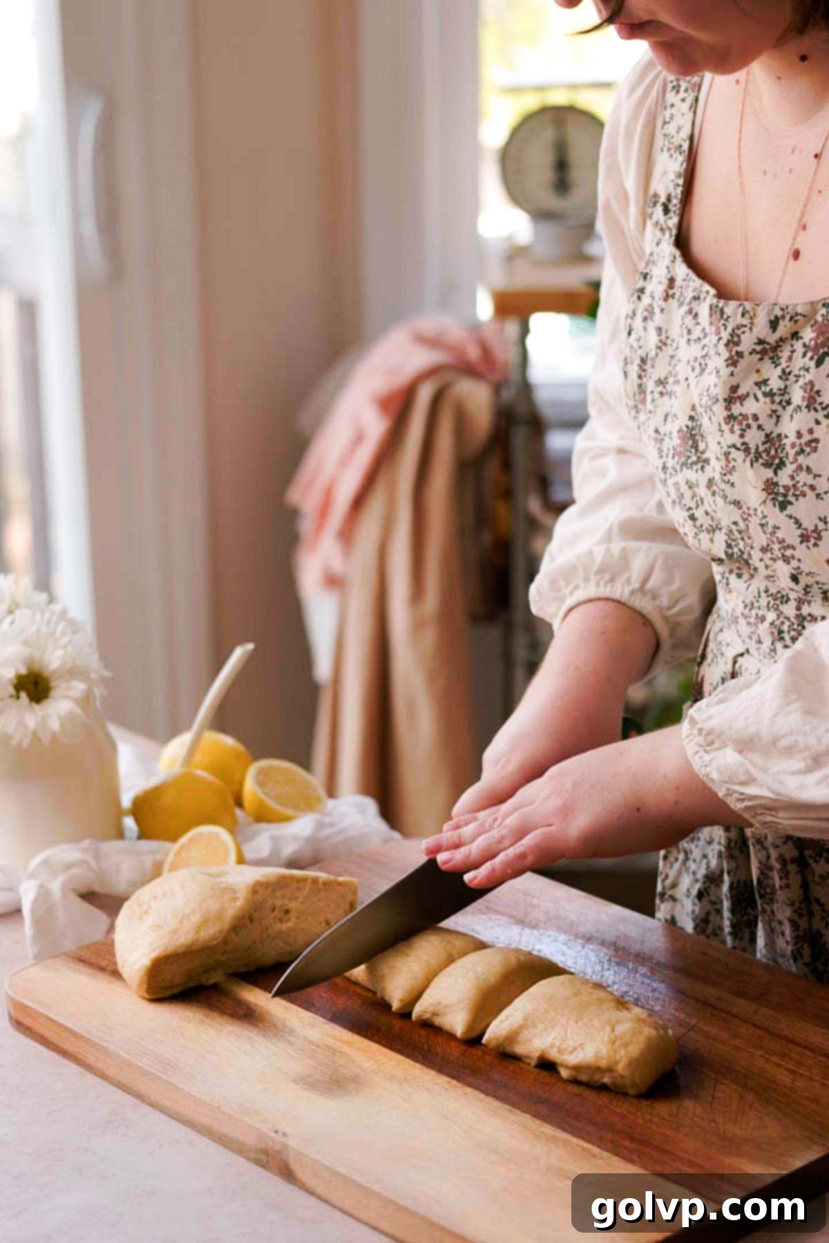 cutting brioche dough into smaller pieces