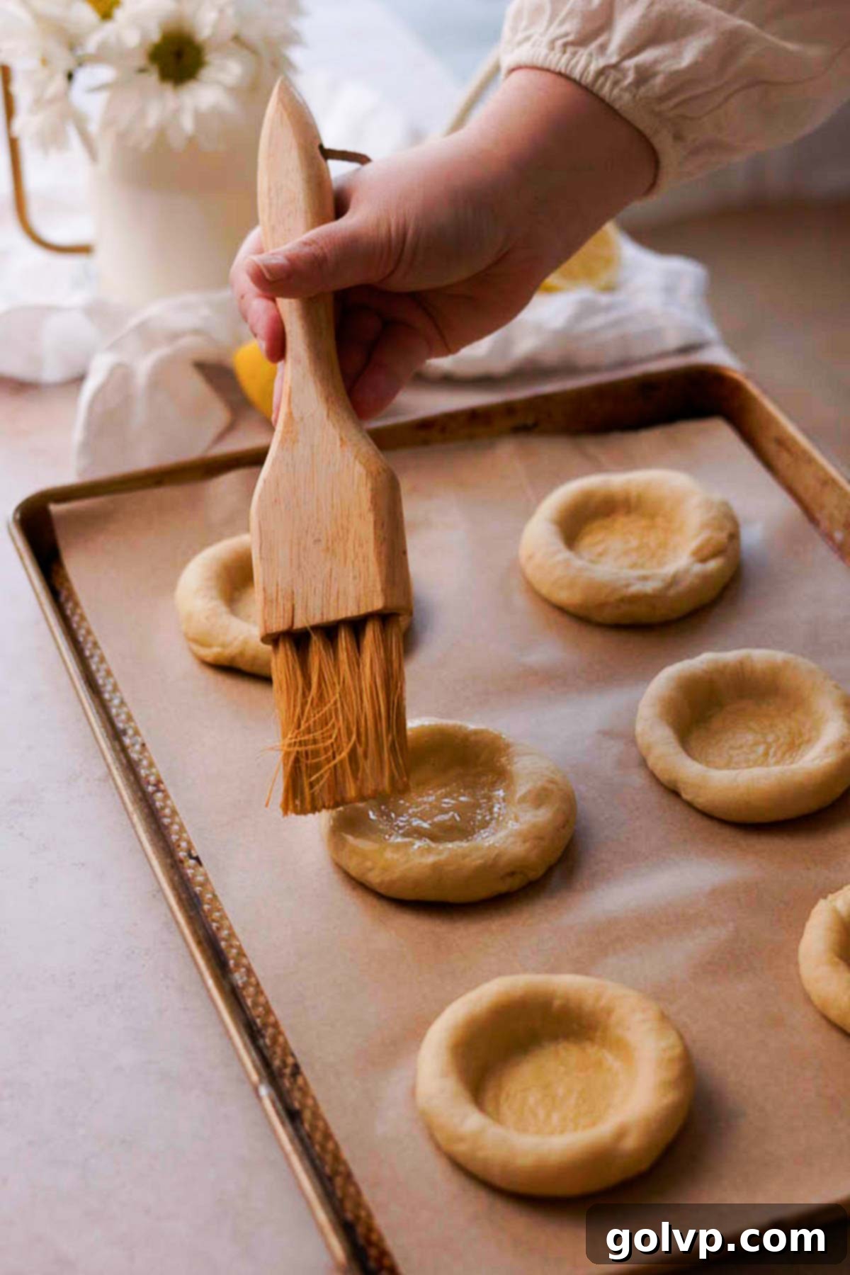 brushing vatrushka dough with eggwash