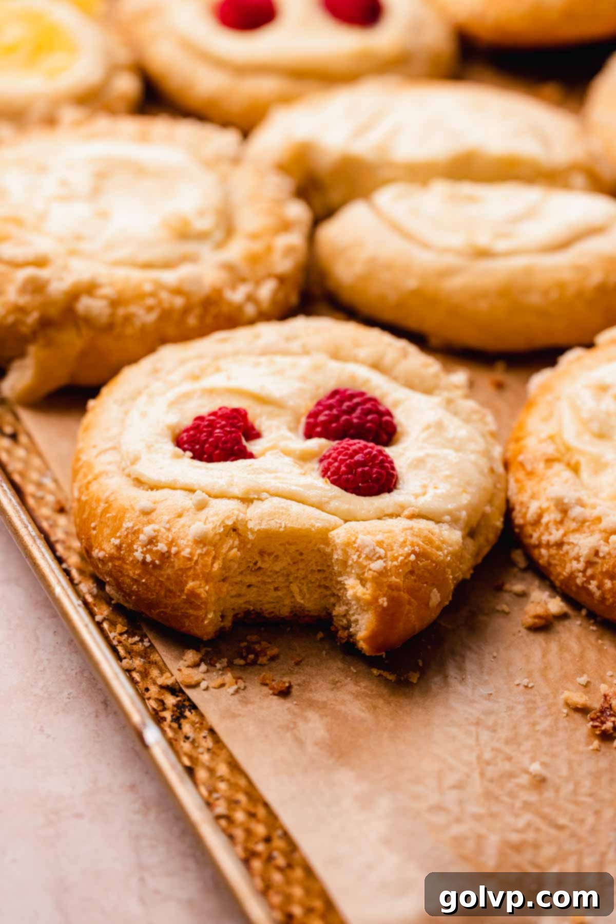 bitten vatrushka bun with raspberries