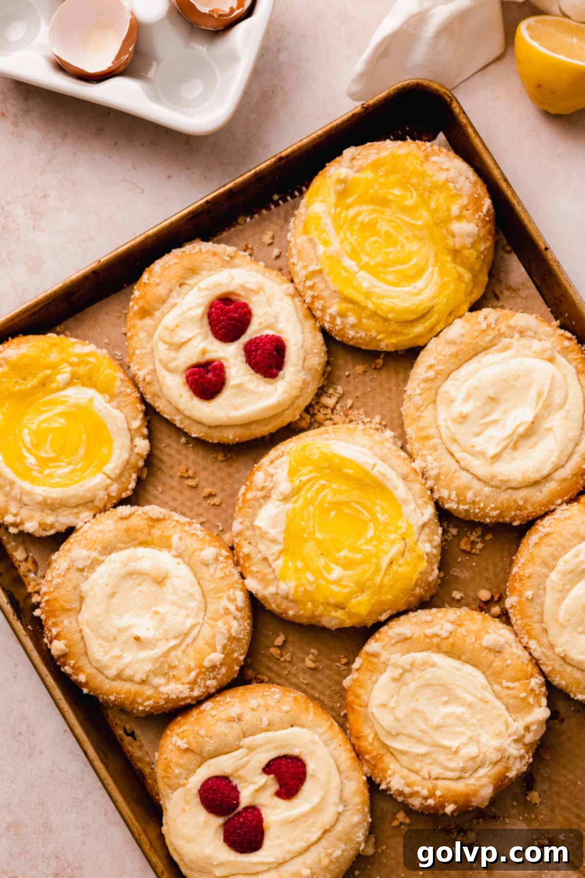 baked vatrushka brioche cheese buns on parchment lined baking tray