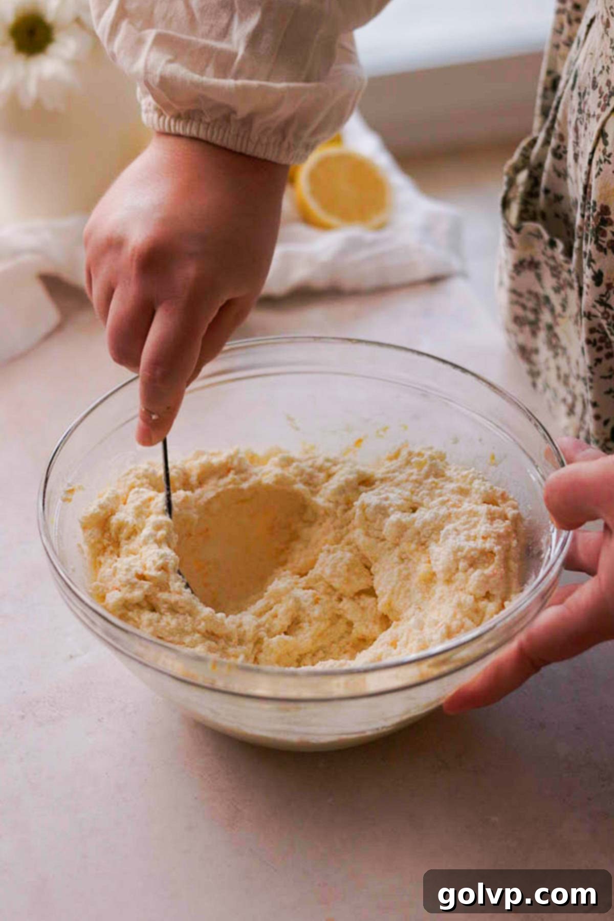 mixing cottage cheese vatrushka filling