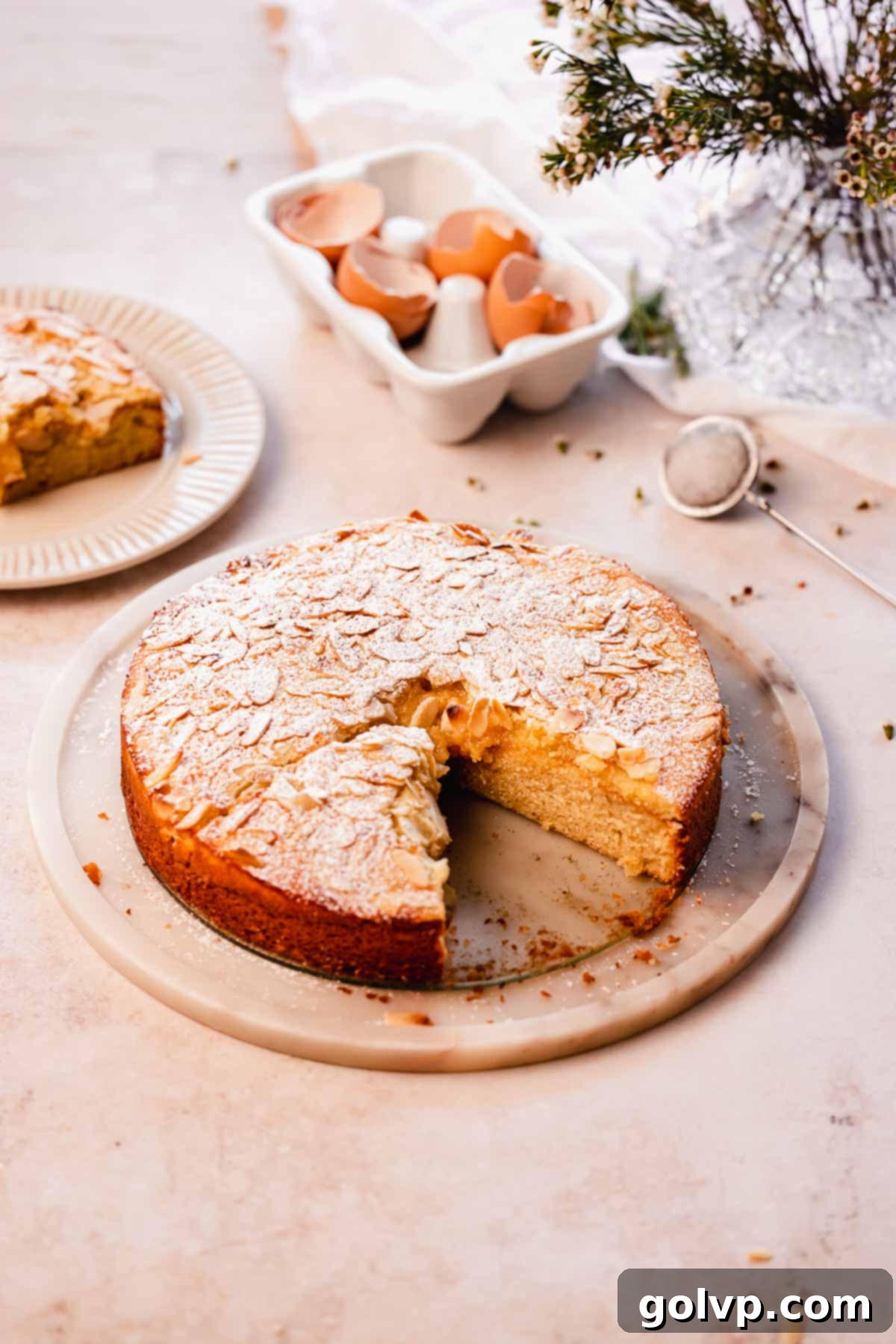 Double Almond Gooey Coffee Cake 17 almond croissant coffee cake on cake stand with gooey almond filling