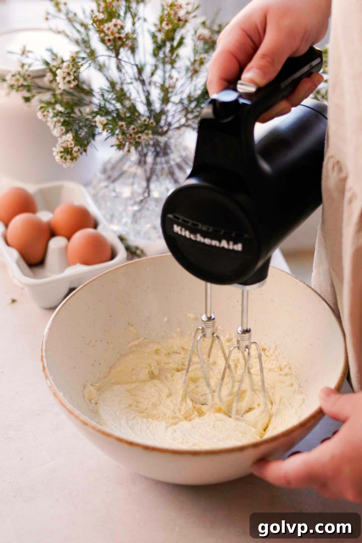 Double Almond Gooey Coffee Cake 5 beating olive oil, butter, and sugar, in a large bowl with an electric mixer