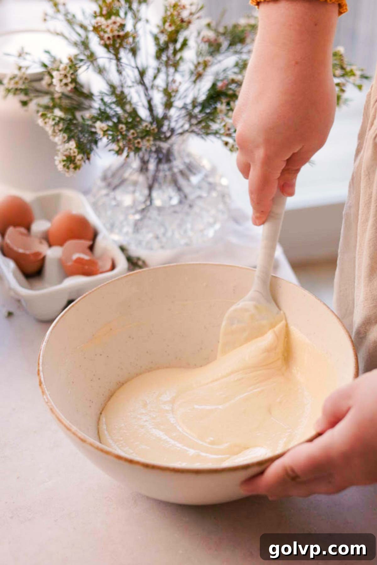 Double Almond Gooey Coffee Cake 7 folding wet ingredients into batter using a spatula