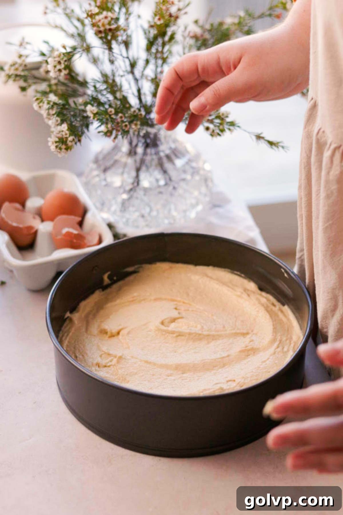 Double Almond Gooey Coffee Cake 9 spreading almond coffee cake batter into round cake pan