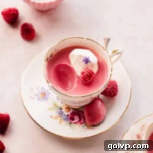raspberry posset in teacup showing thick and creamy texture