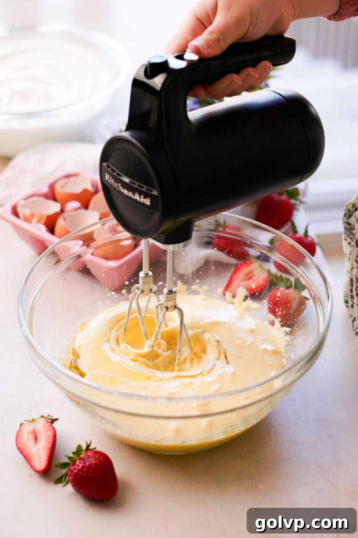 mixing chiffon cake batter ingredients with electric mixer