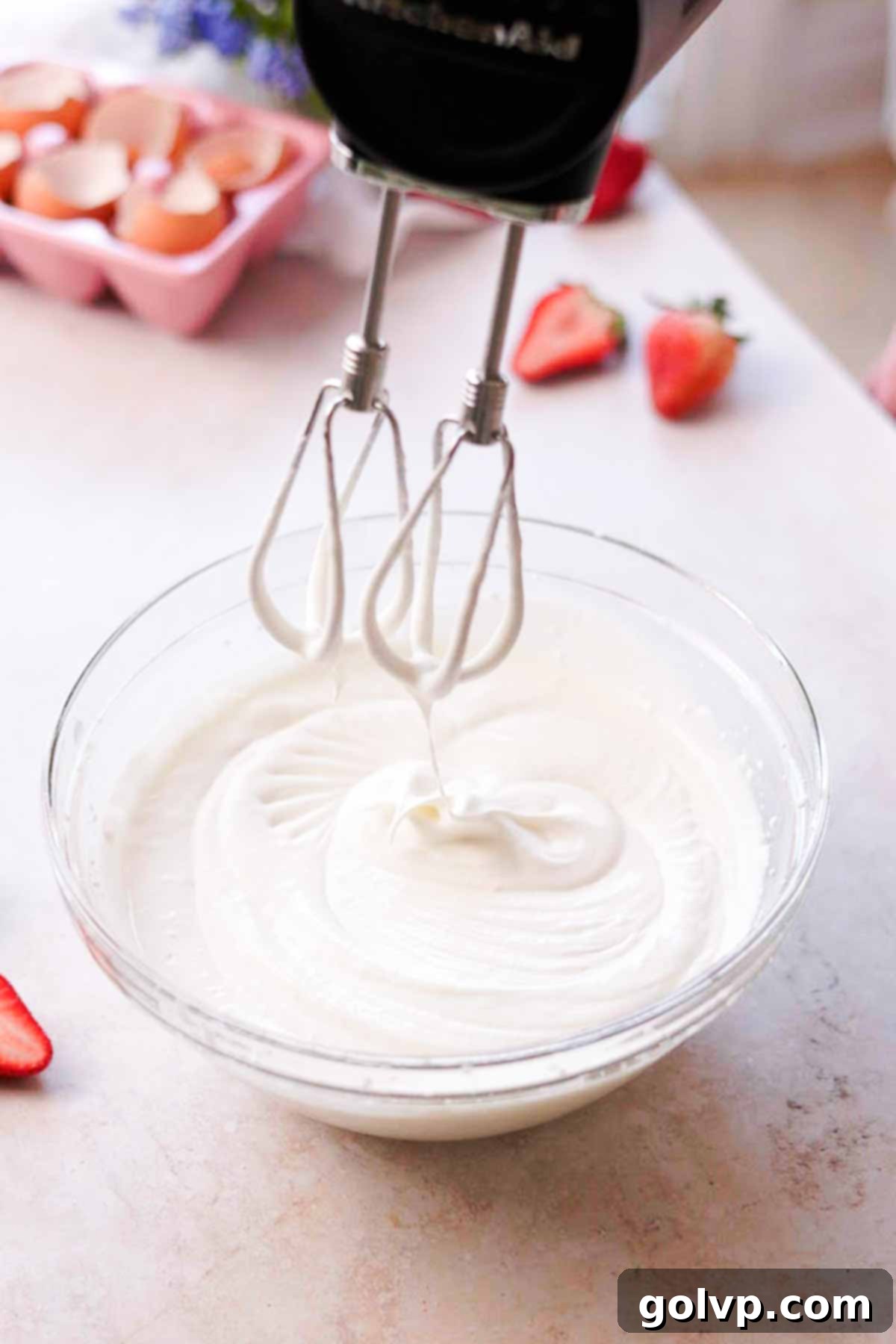 cream whipped to soft peaks in glass bowl