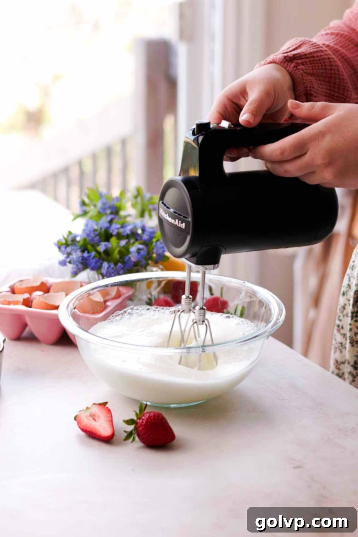whipping egg whites to medium peaks in glass bowl