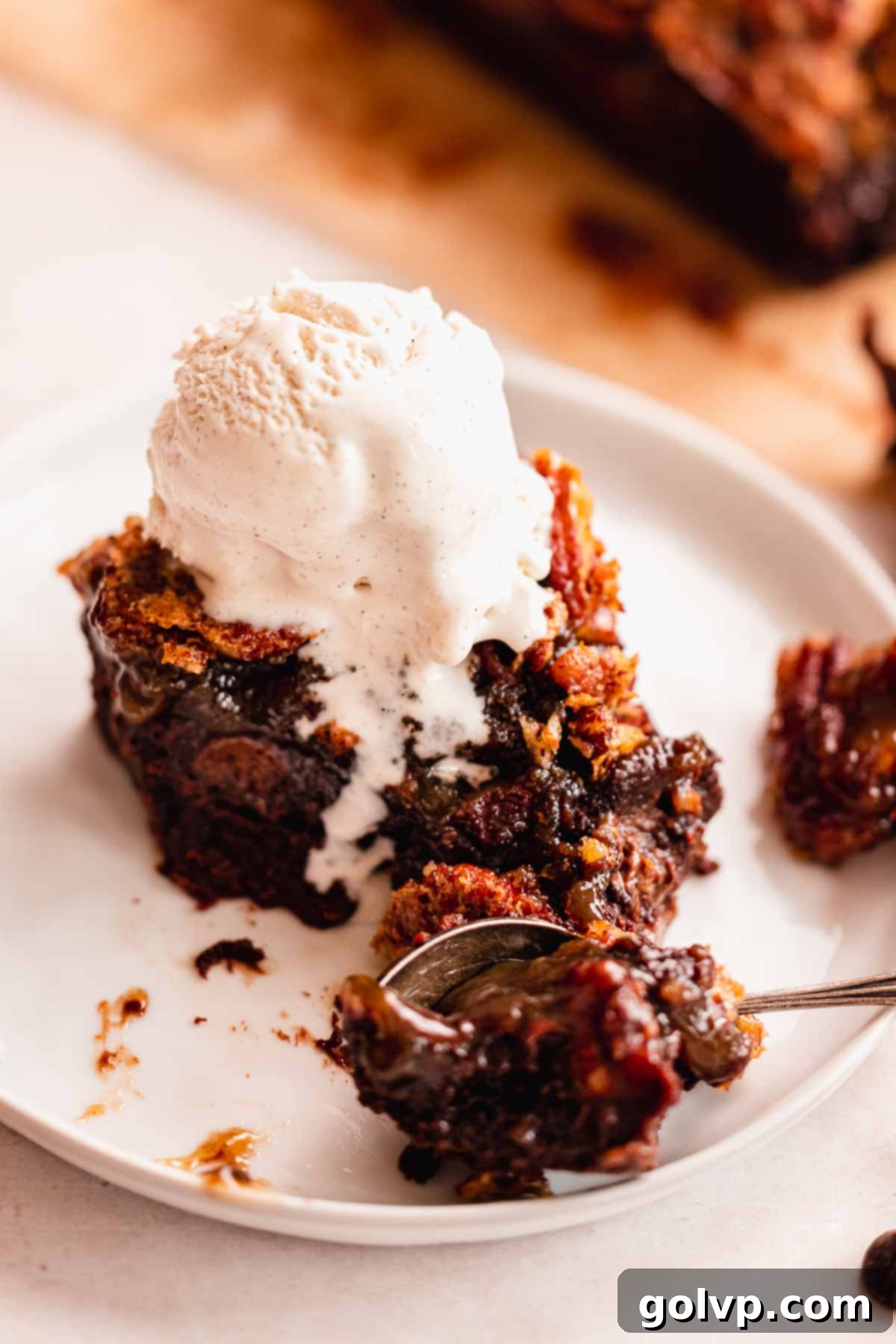 a whole sheet of baked pecan pie brownies on a cooling rack, ready for slicing