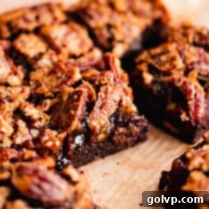 pecan pie brownie cut in squares, showing the layers of fudgy brownie and gooey pecan topping