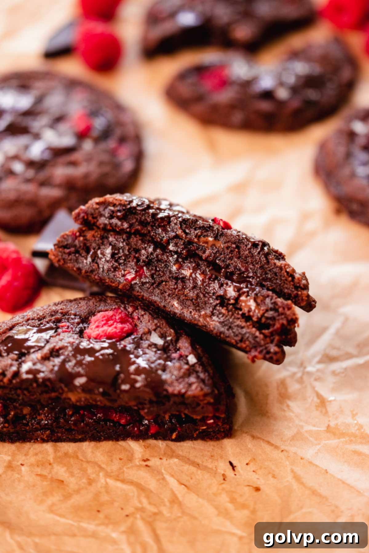 a close up of split cookies with a fudgy layer inside