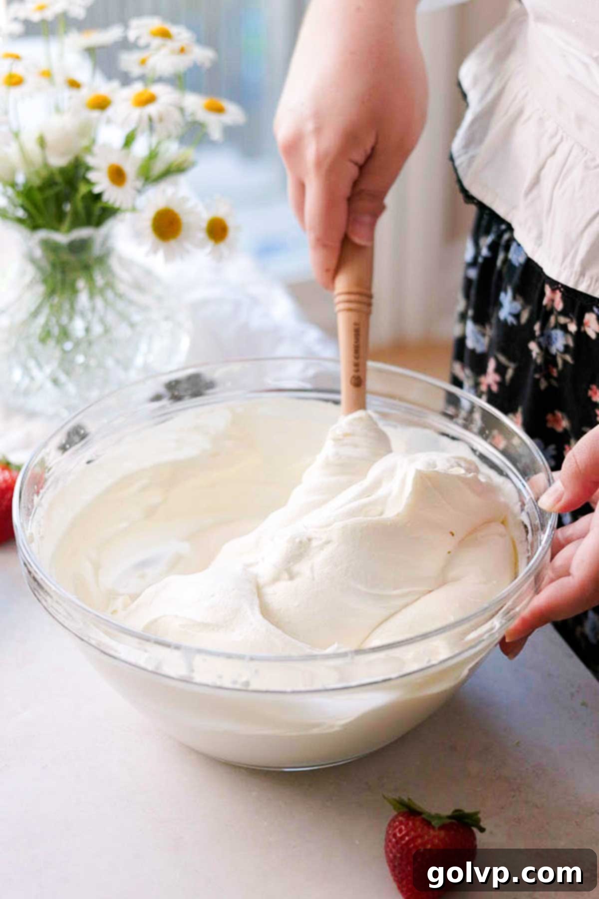 folding mascarpone into whipped cream with a spatula