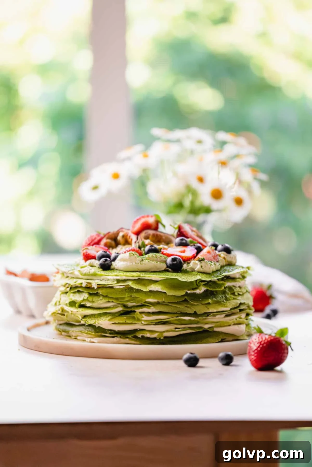 matcha crepe cake sitting on a plate