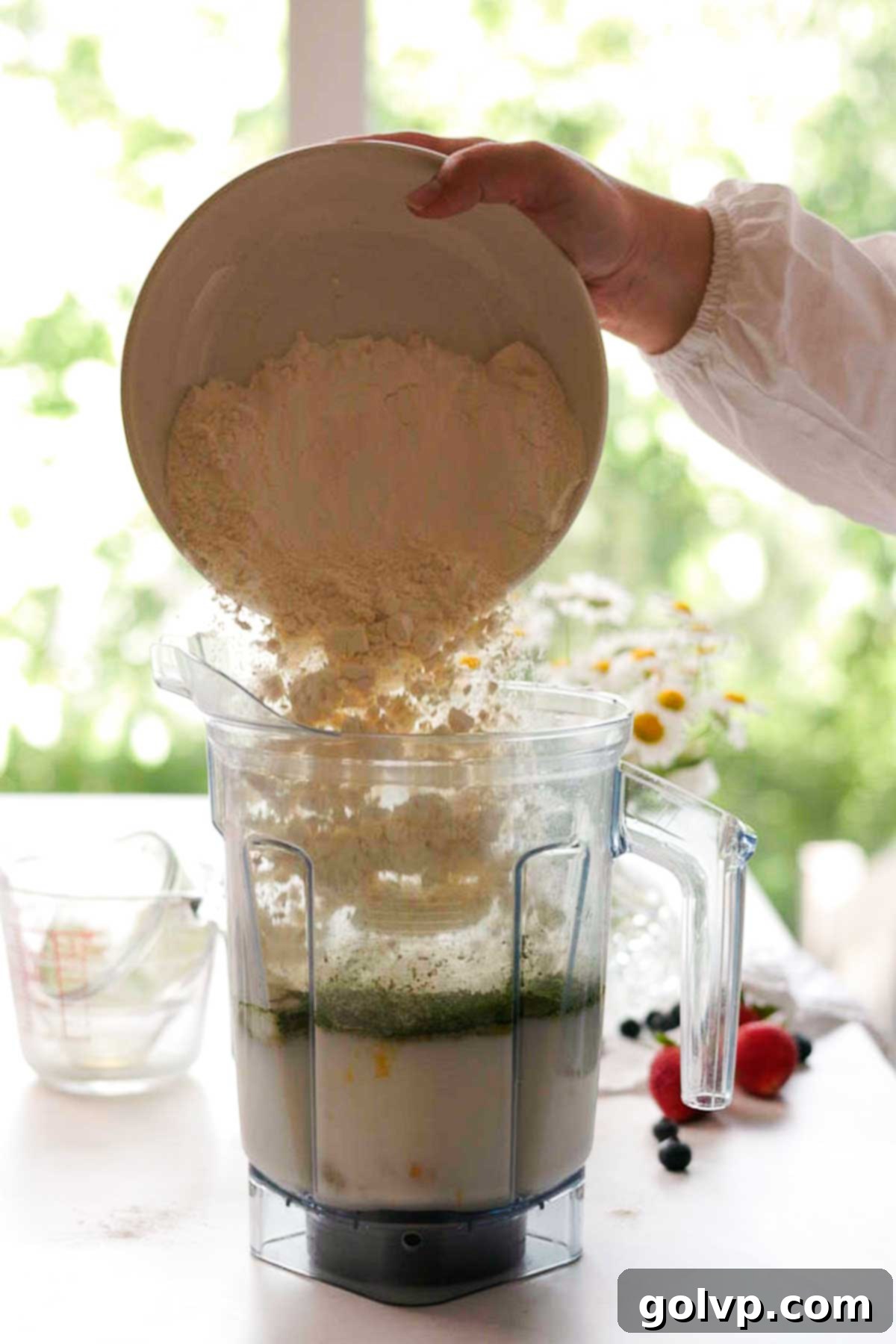 combining matcha crepe ingredients in a blender