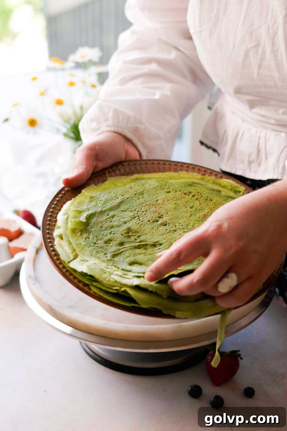 a stack of matcha crepes on a plate