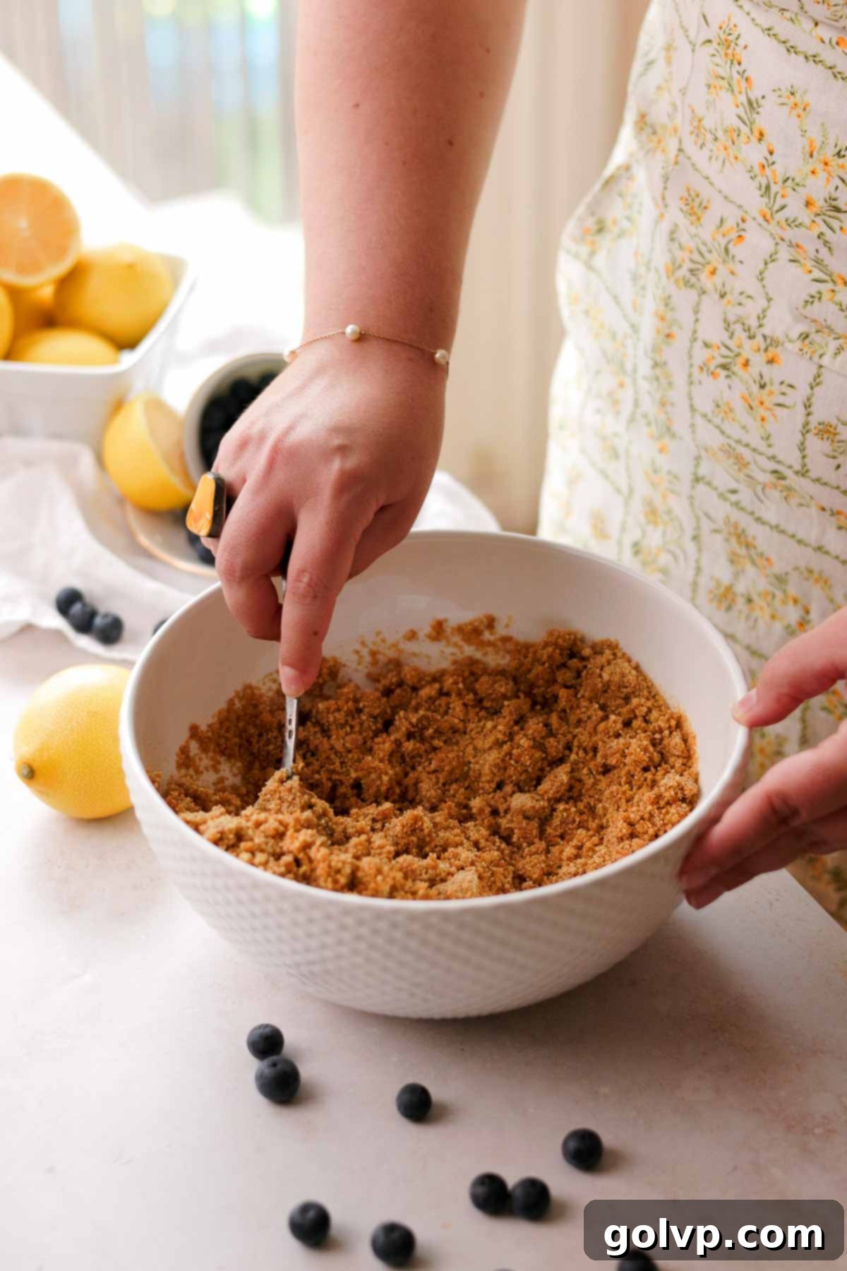 stirring graham crust together with a spoon