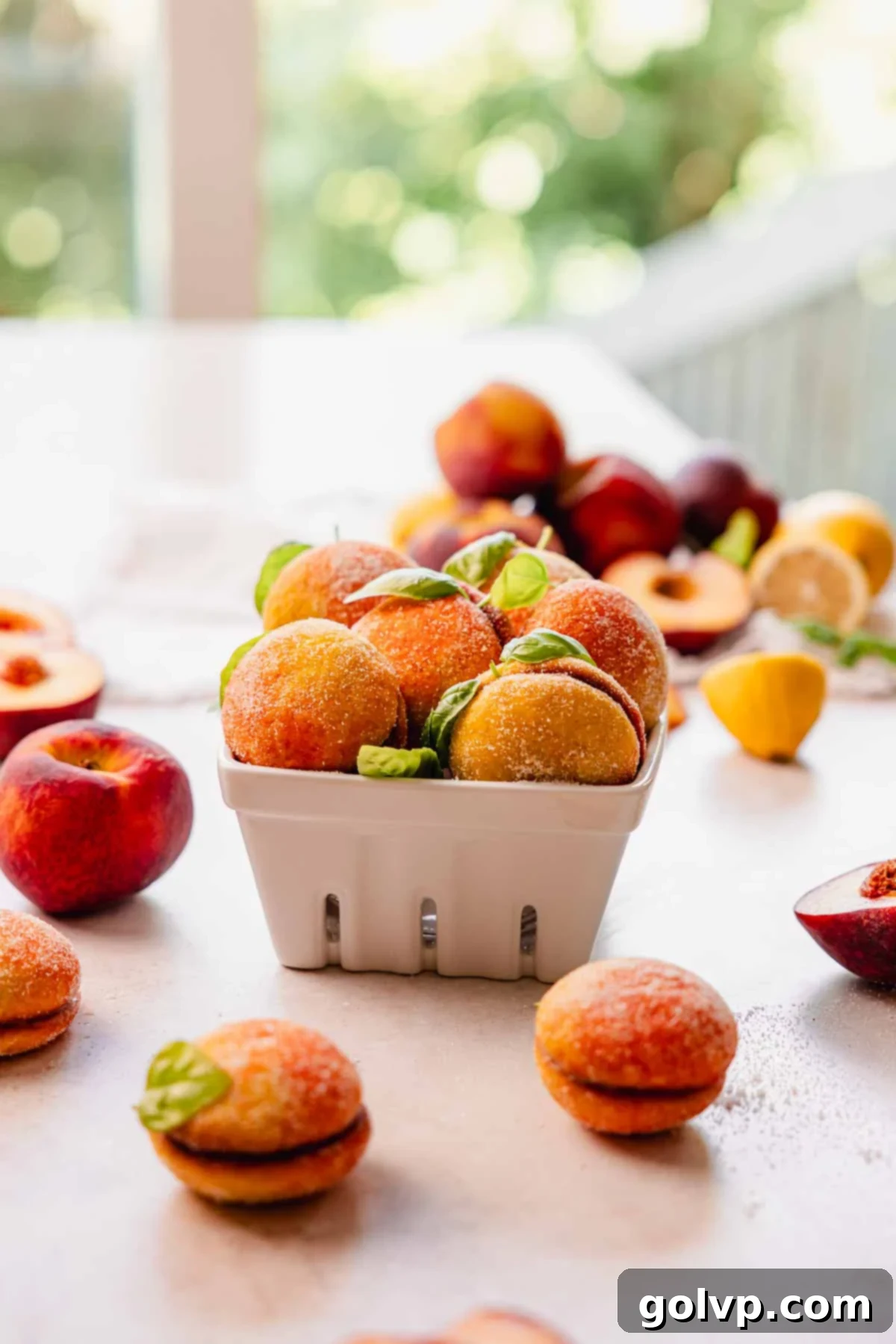 peach italian wedding cookies in a fruit basket
