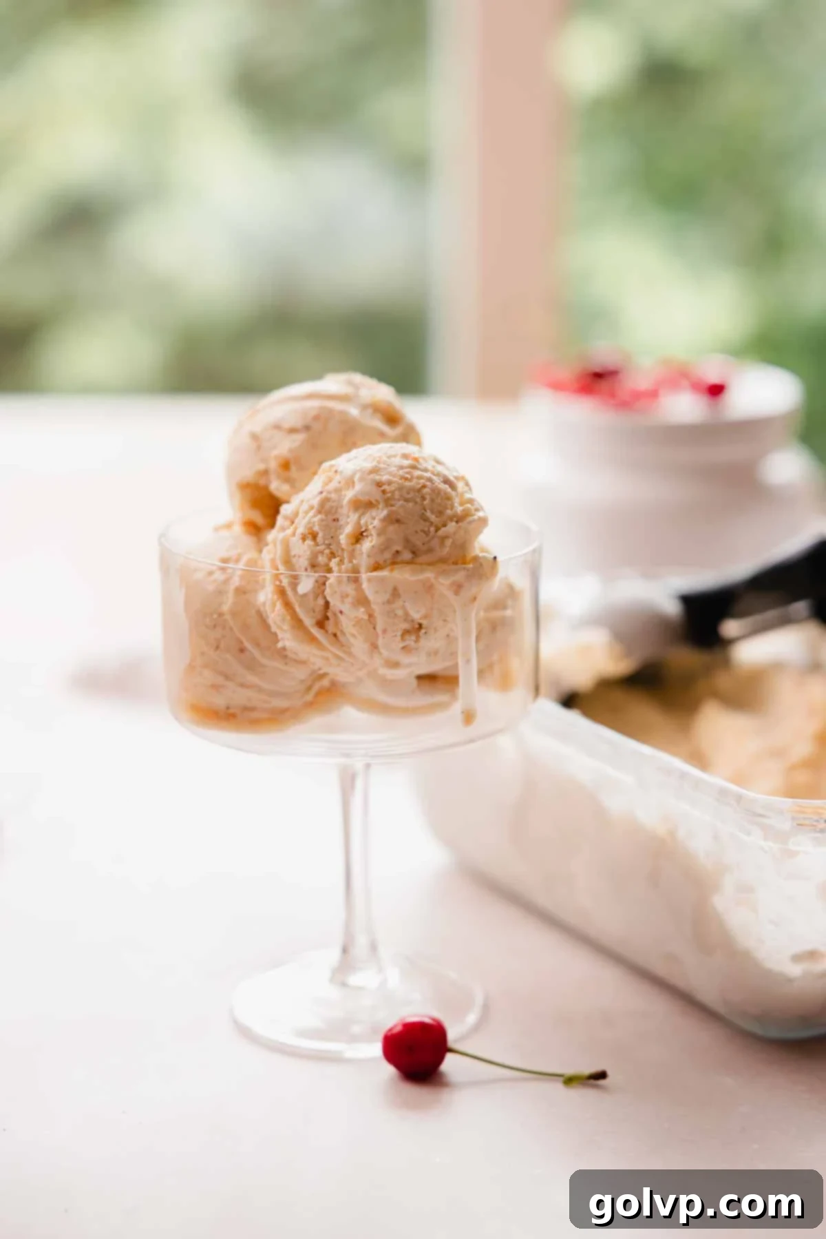 Nutty Brown Butter Ice Cream 2 Ice cream slowly melting in a glass, showcasing its rich and creamy texture.