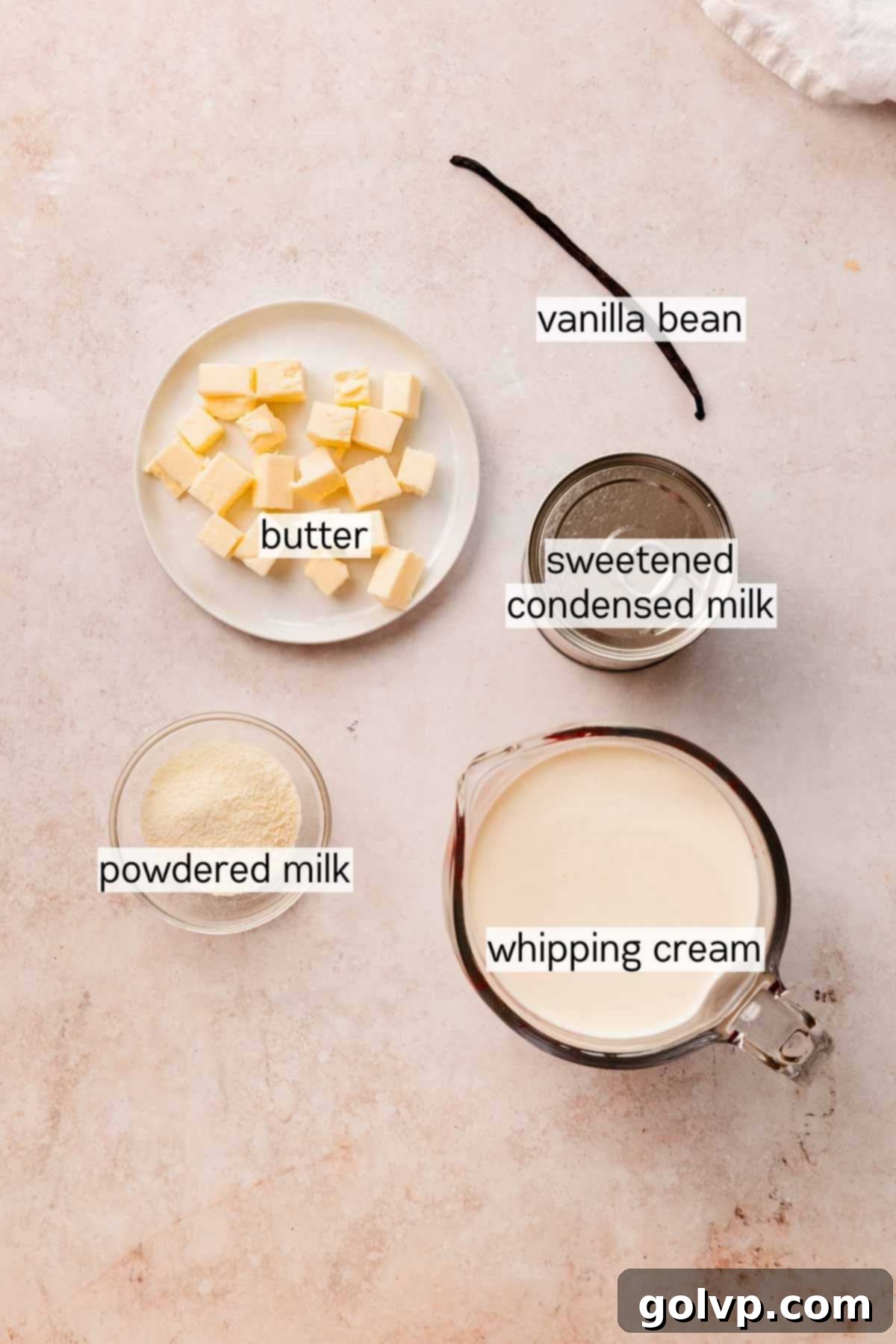 Nutty Brown Butter Ice Cream 4 Bowls and measuring cups filled with all the ingredients for brown butter ice cream on a countertop.