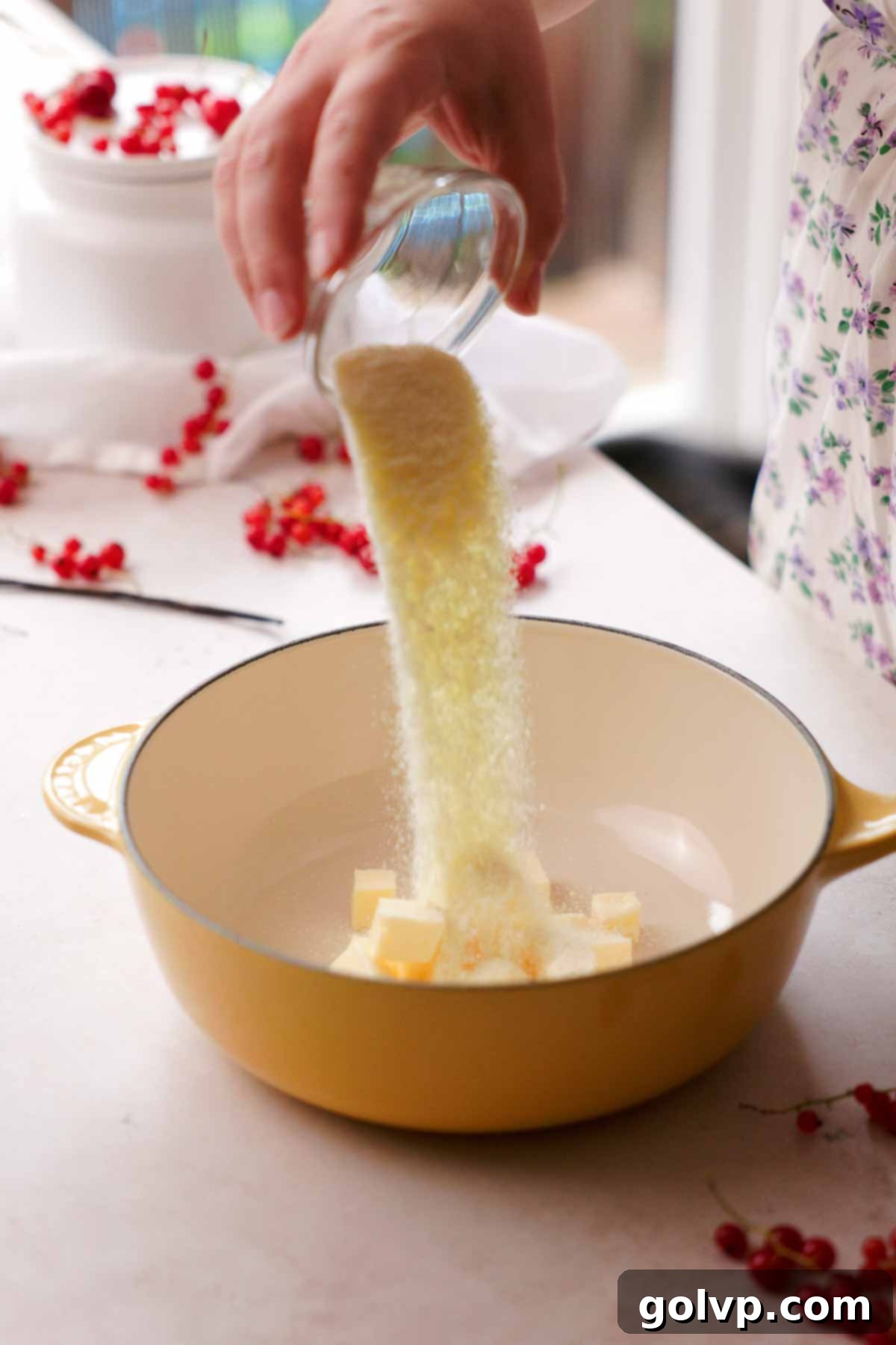 Cubes of butter and milk powder being combined in a small pot for browning.