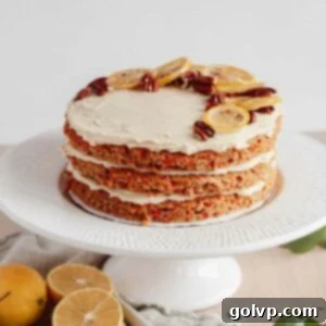 triple layer vegan carrot cake with candied lemons and pecans on top
