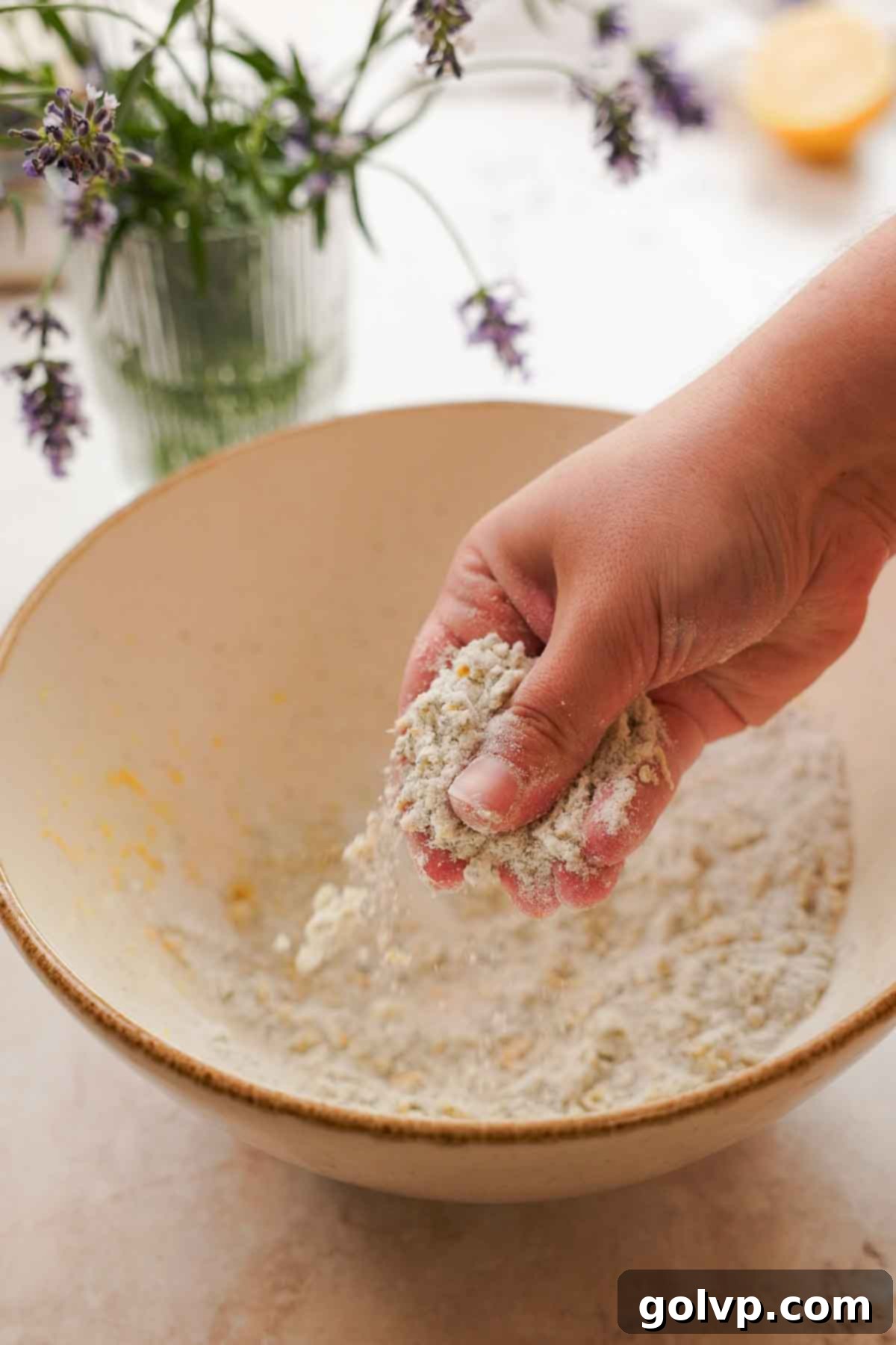 rubbing lemon zest, sugar, and lavender together