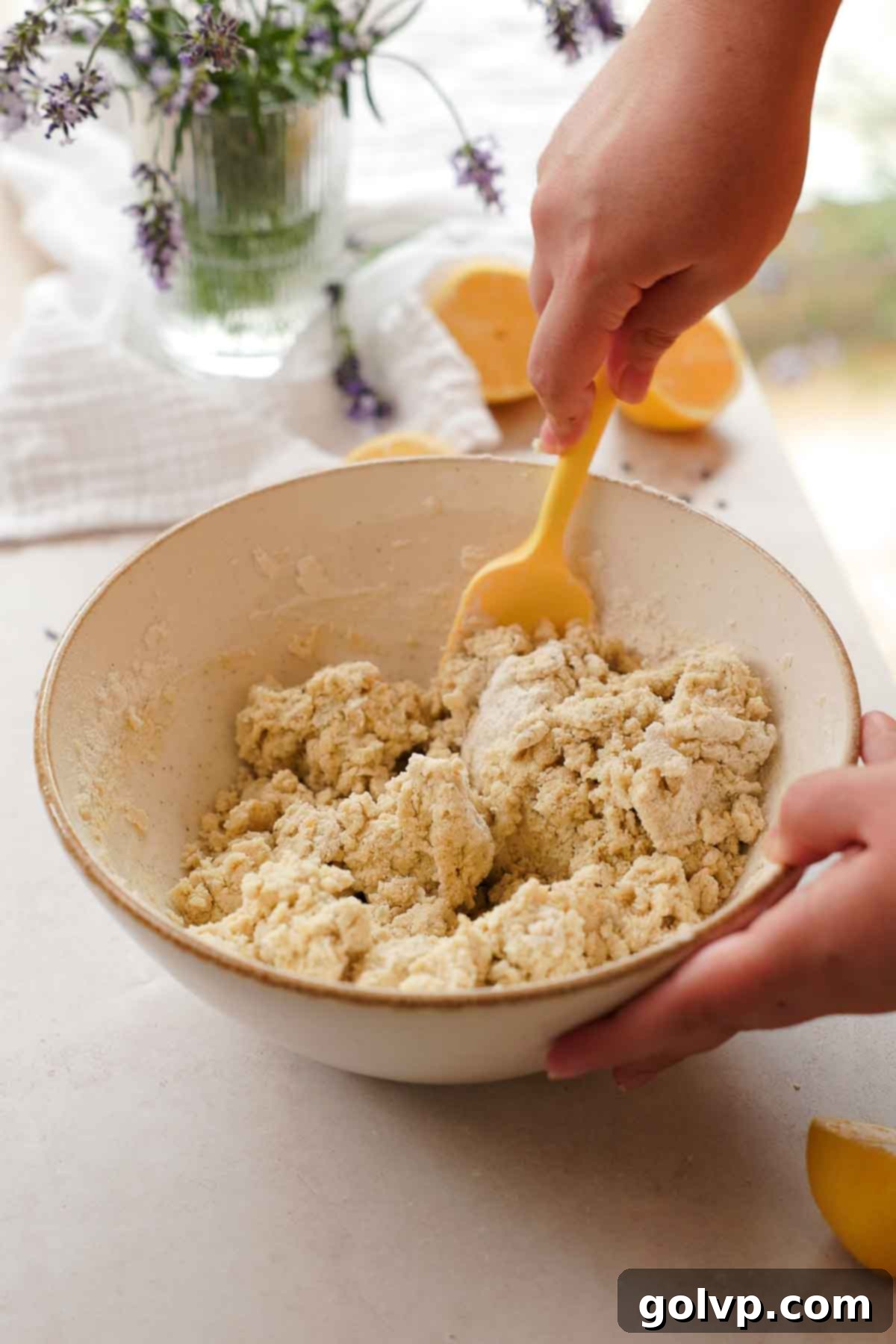 stirring flour into lavender shortbread cookie dough