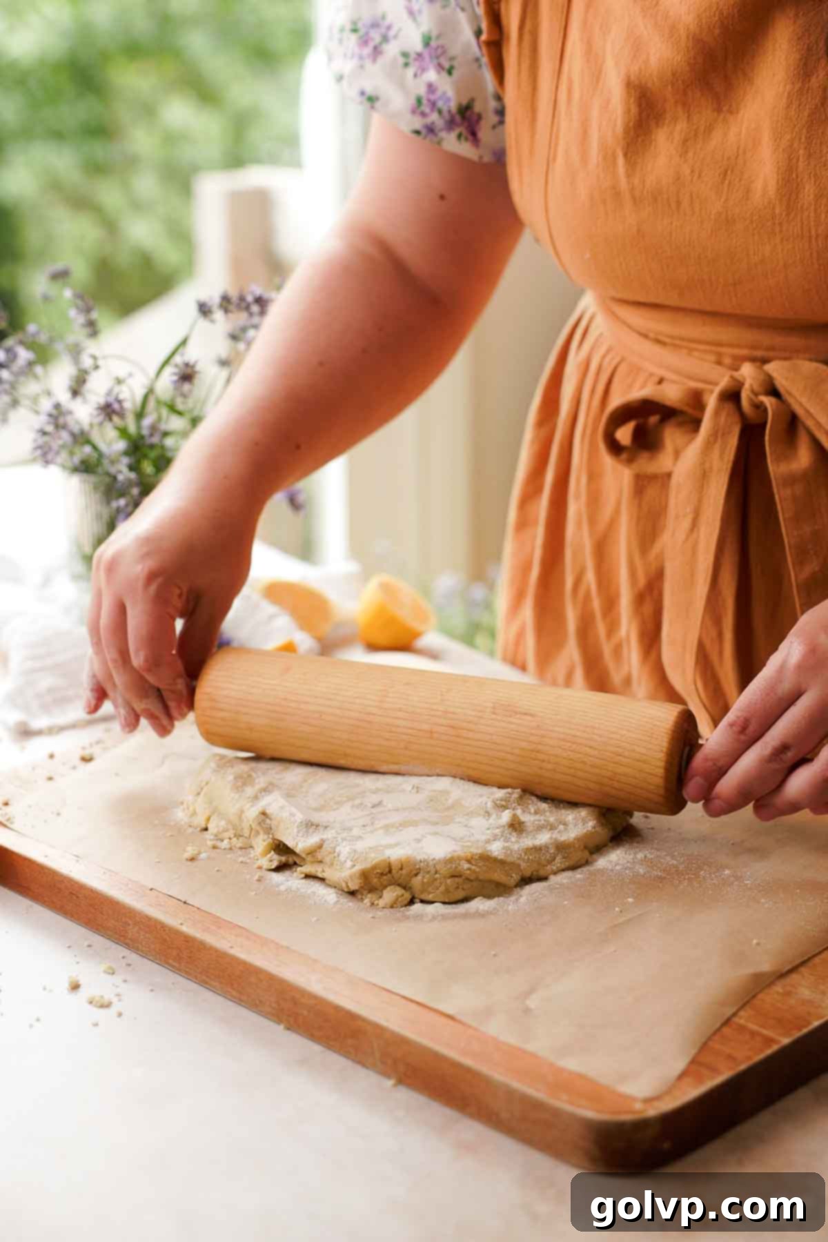 rolling out lavender lemon shortbread cookie dough with rolling pin