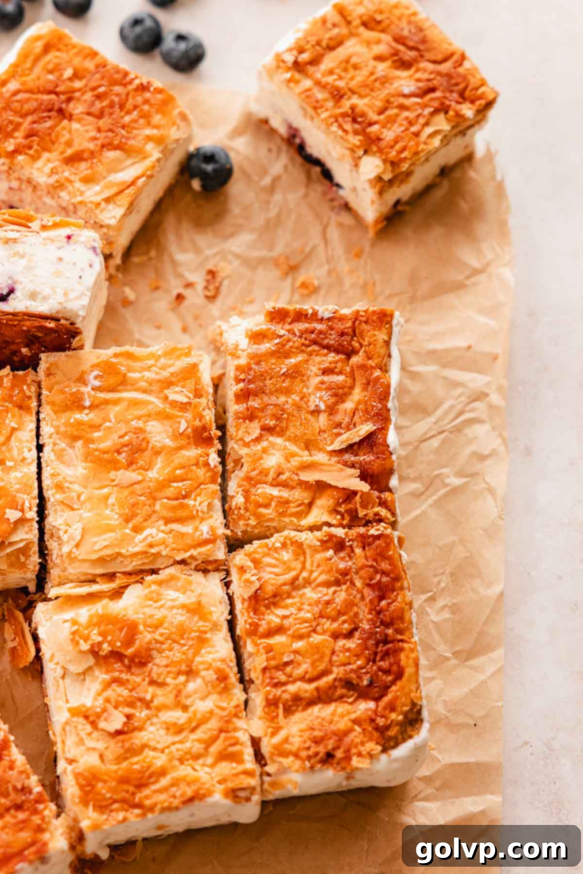 puff pastry ice cream sandwiches arranged beautifully on parchment paper
