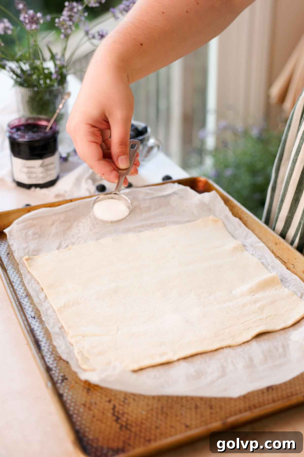 sprinkling sugar on all butter puff pastry before baking