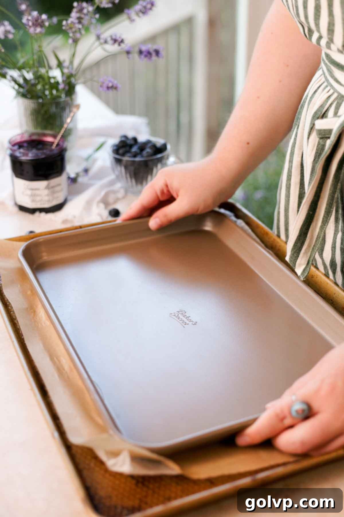 placing another baking sheet directly onto the sugared puff pastry