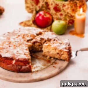 slice of apple fritter cake with vanilla glaze on a cake spatula