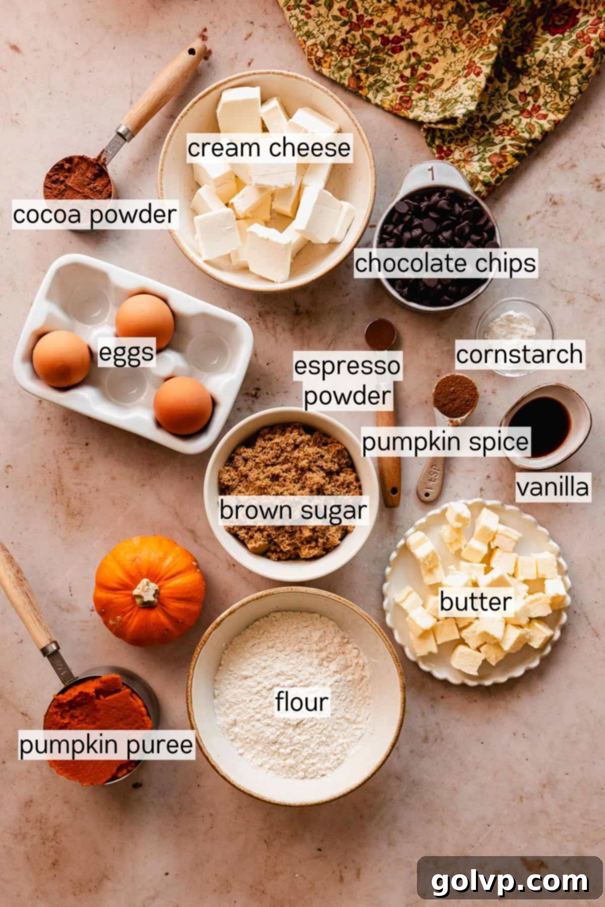 ingredients for pumpkin cheesecake brownies in bowls