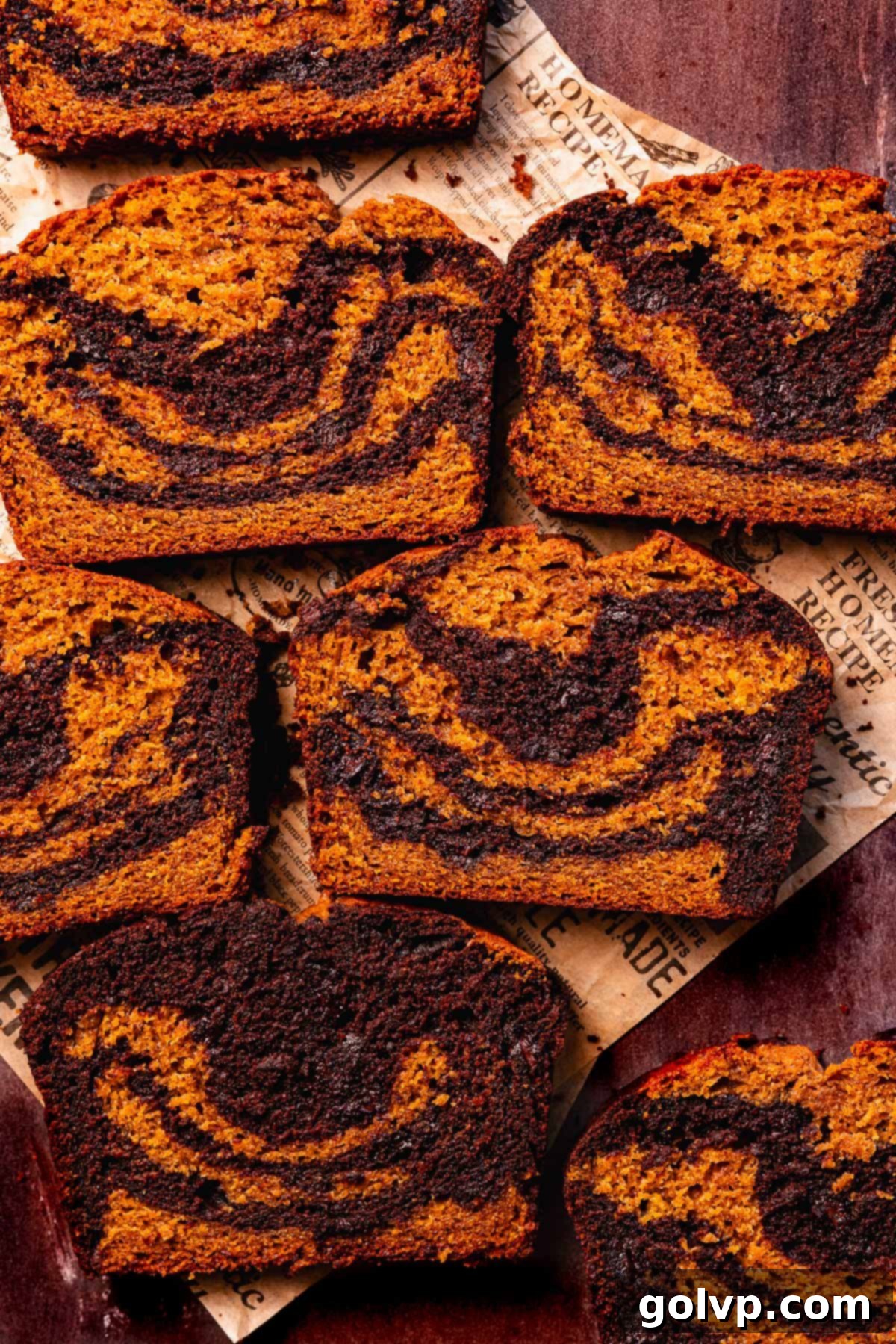 slices of pumpkin and chocolate bread with swirls and chocolate chips, showcasing the beautiful marbling
