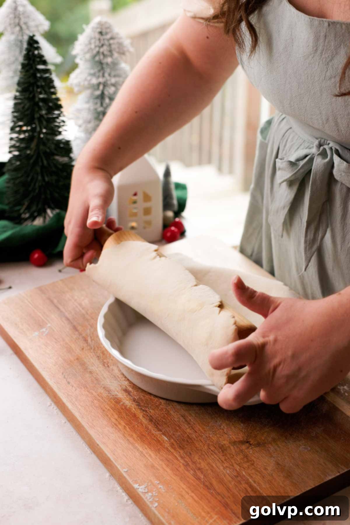 placing pie crust in pie plate