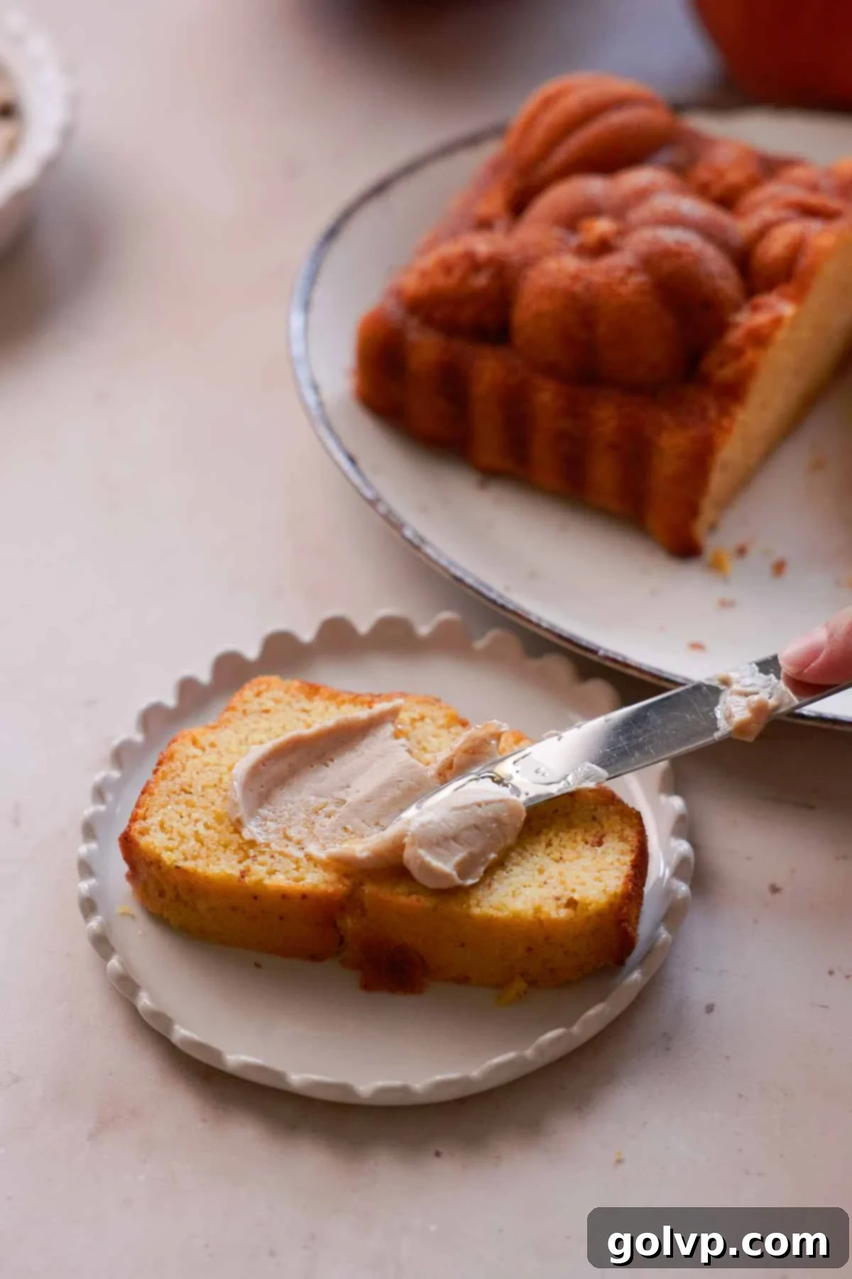 spreading cinnamon honey butter onto cornbread