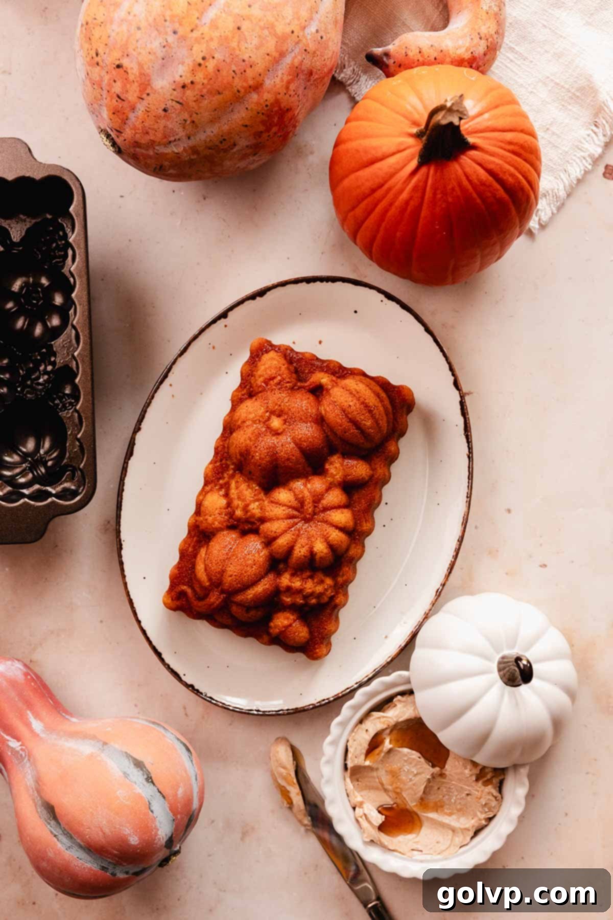 cornbread loaf shaped in pumpkins on oval tray