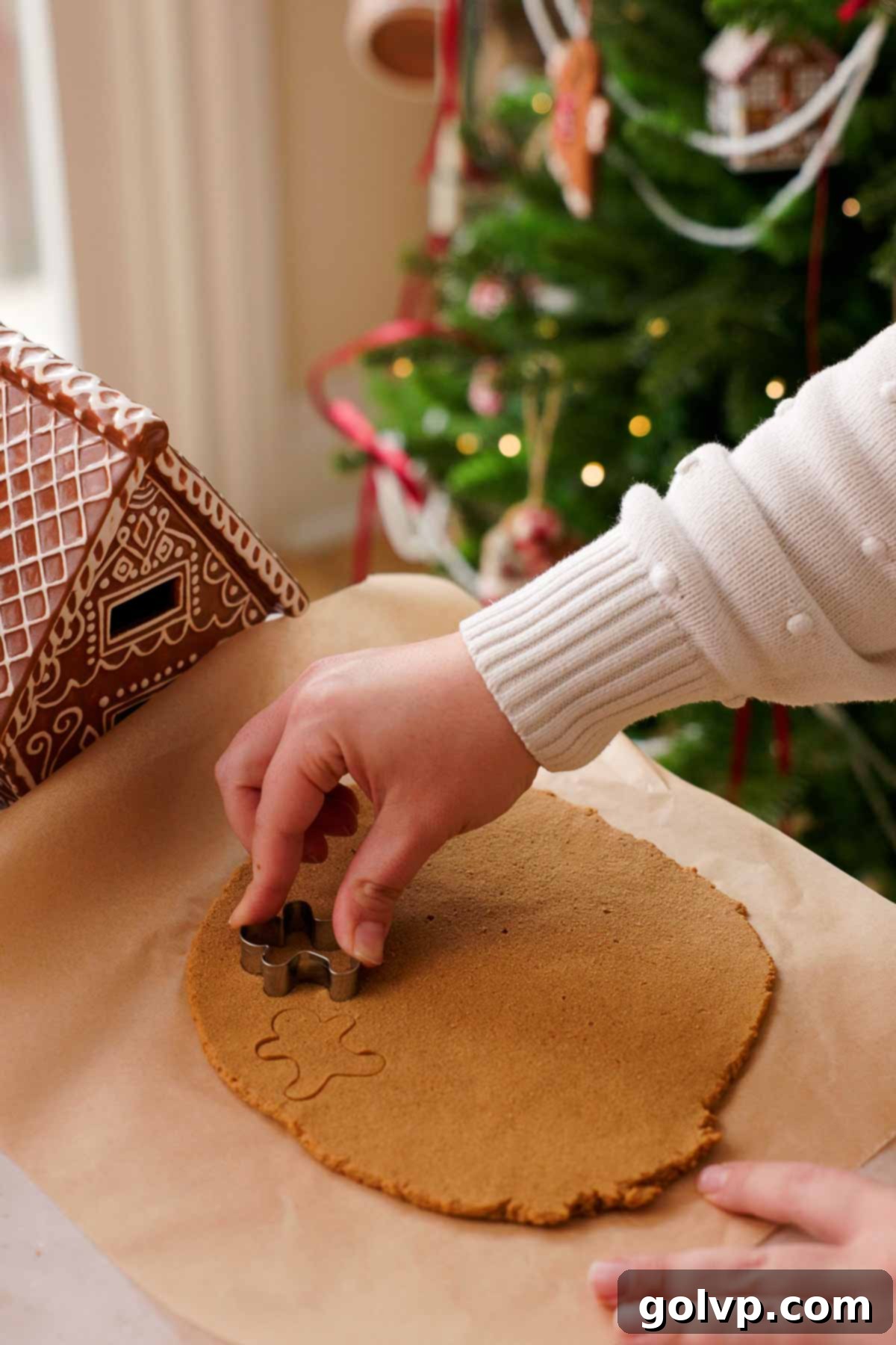 cutting out mini gingerbread cookies