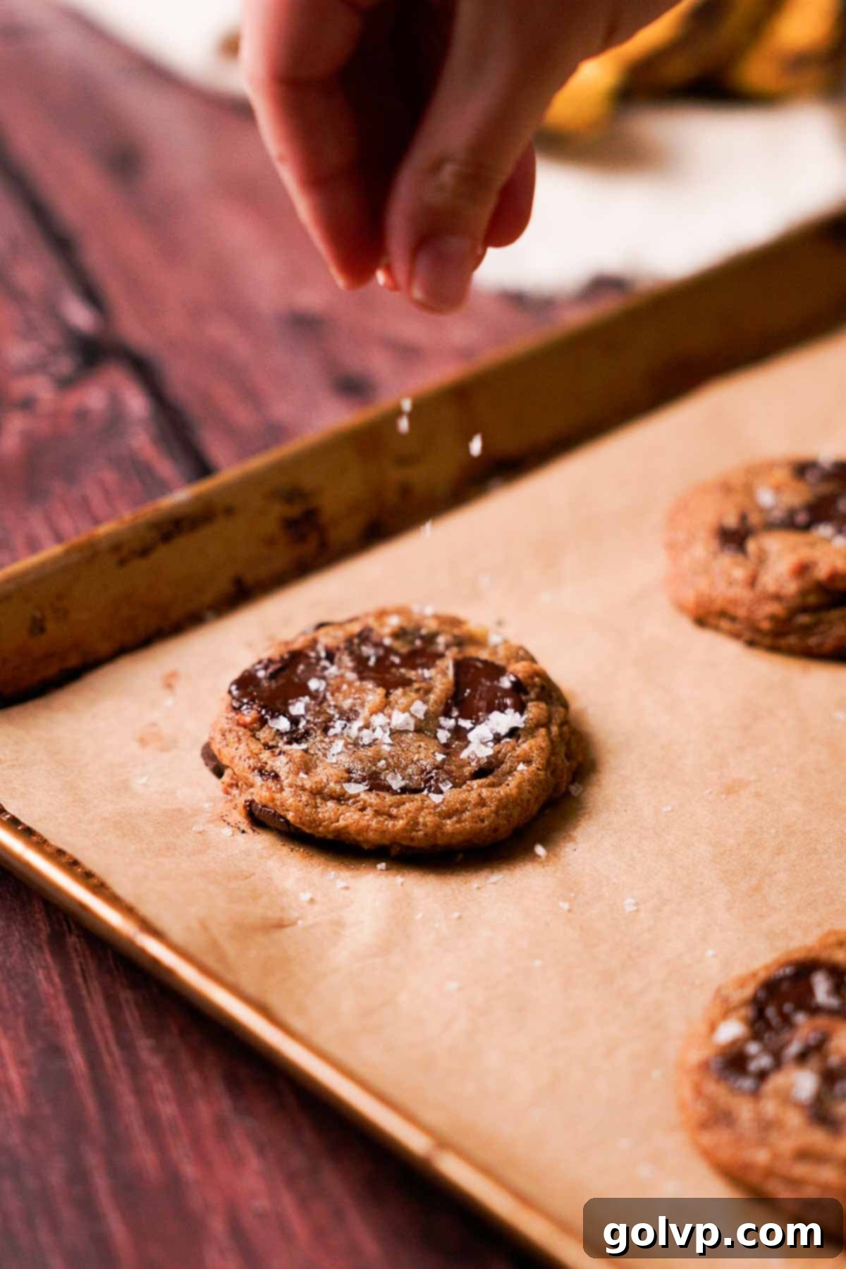 Soft-Baked Banana Bread Cookies 11 sprinkling salt on banana bread cookie