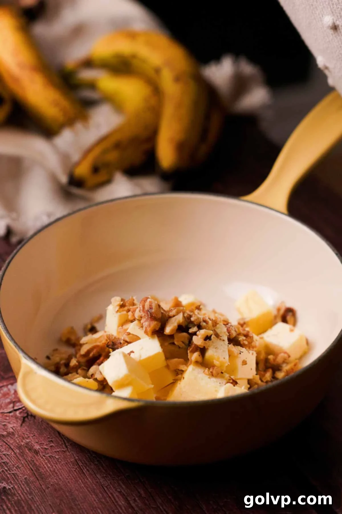 Soft-Baked Banana Bread Cookies 4 combining butter and chopped walnuts in a saucepan